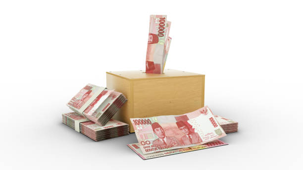 rendu 3d de billets de roupie indonésienne dans une boîte d’épargne en bois. - indonesian currency photos et images de collection