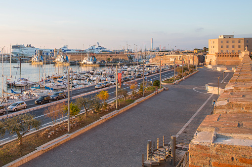View of Lanterna (lighthouse) in the old port of the city of Genoa at sunset, Italy