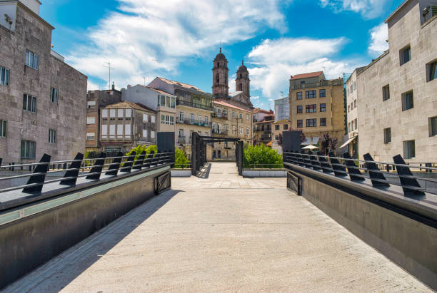 pedestrian street in the city of vigo with the bell towers of the cathedral in the background, spain - gangplank imagens e fotografias de stock