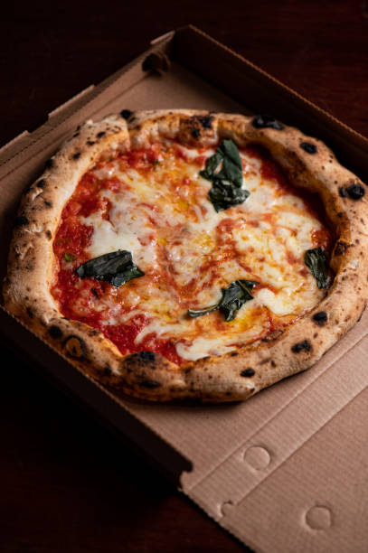 istock Neapolitan margherita pizza delivery in box 1387488647