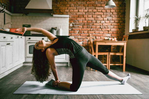 istock Stretching Exercises For Female Beauty In Home Kitchen 1387490929