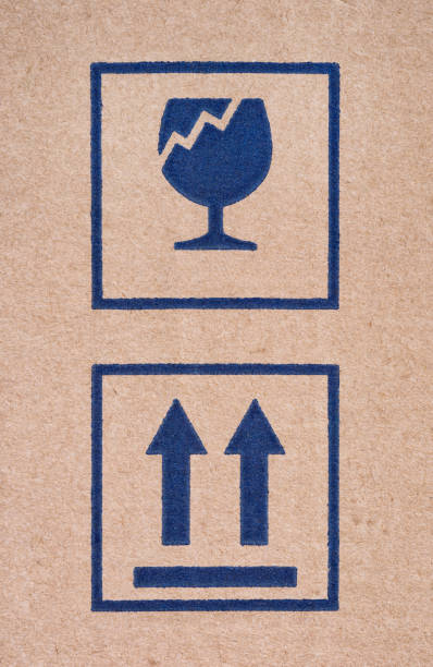 istock Two signs on cardboard box - Fragile and This Way Up. 1387492348
