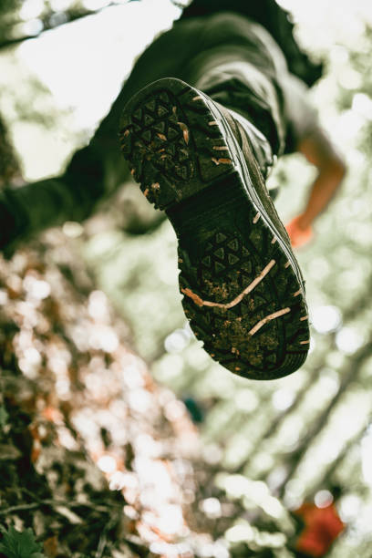 istock Low Angle View Of Hiker Climbing On Mountain Hill 1387493461