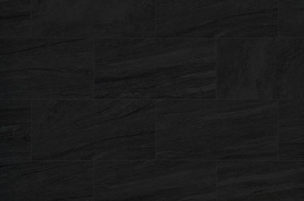 istock black travertine marble tile patterned use as background for luxury and elegance concept. dark black marble texture abstract background pattern or marble tile wall. 1387496324