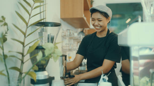istock Employees make coffee in the shop for customers. 1387496502