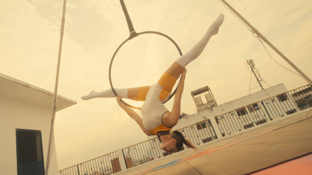 Female athlete practicing fly yoga poses