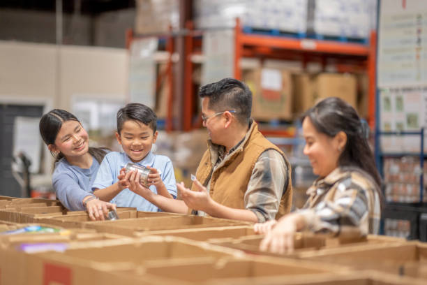 istock Packing at a Local Food Bank 1387498718