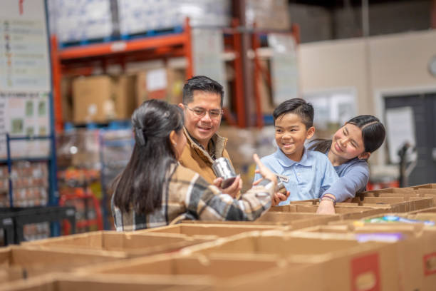 istock Packing at a Local Food Bank 1387498719