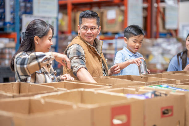istock Packing at a Local Food Bank 1387498721