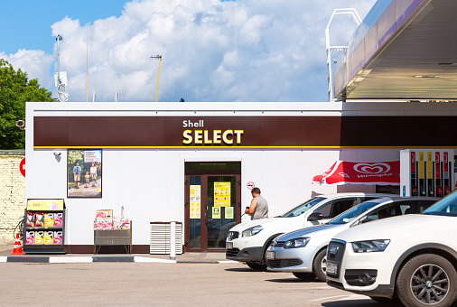 Samara, Russia - July 4, 2021: A Shell Select storefront at Shell gas station. Royal Dutch Shell is an Anglo-Dutch multinational oil and gas company