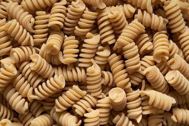 istock background pattern of Italian fusilli pasta 1387500973
