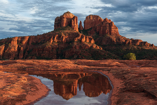 Scenic red rock landscape at sunset with Cathedral Rock in Sedona, Arizona, USA.