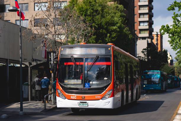 Santiago, Chile -  October 2021: A Transantiago, or Red Metropolitana de Movilidad,  public transport bus in downtown Santiago during a week day. This bus is part of the Transantiago public transport system, which covers Santiago and includes the Subway since 2007