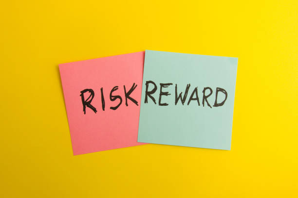 istock Words risk and reward handwritten on colorful sticky notes 1387503993