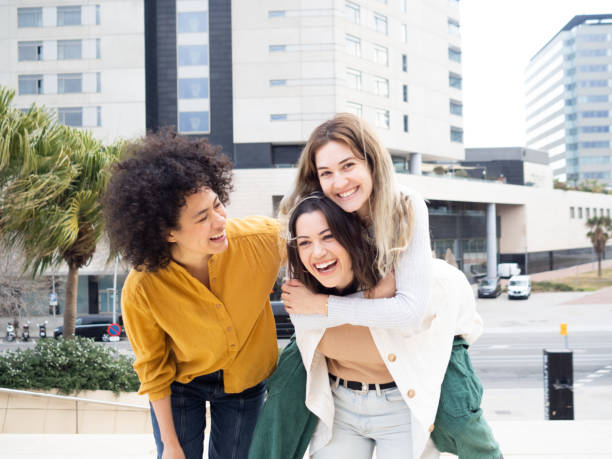 istock Three young multiethnic female friends having fun 1387507977