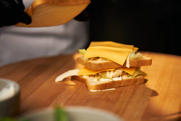 istock Vegetarian club sandwich on cutting board. 1387508112