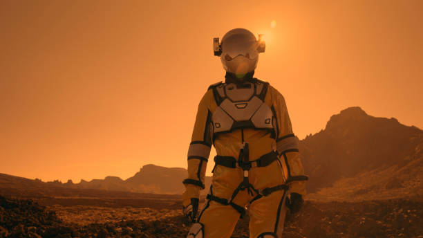 istock A walk on Mars. Female astronaut exploring rust mountains. Admiring the view 1387508892