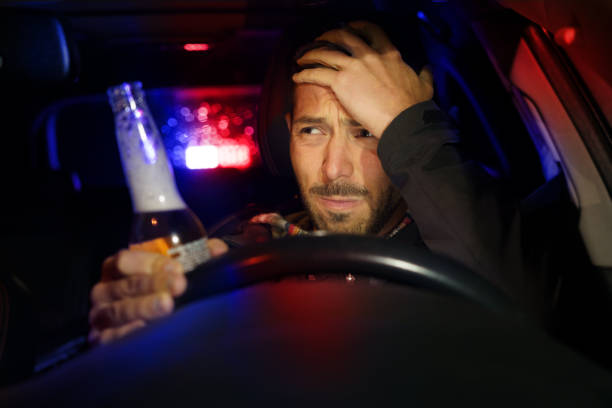 Drunk man driving car. Police stopped driver under alcohol influence Drunk man driving car. Police stopped driver under alcohol influence. High quality photo driving under the influence stock pictures, royalty-free photos & images