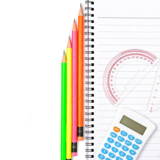 Calculator, ruler, pencils and notepad isolated on white background. Free space for text.
