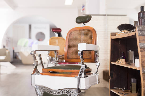istock Barbershop chair with professional tools 1387512474