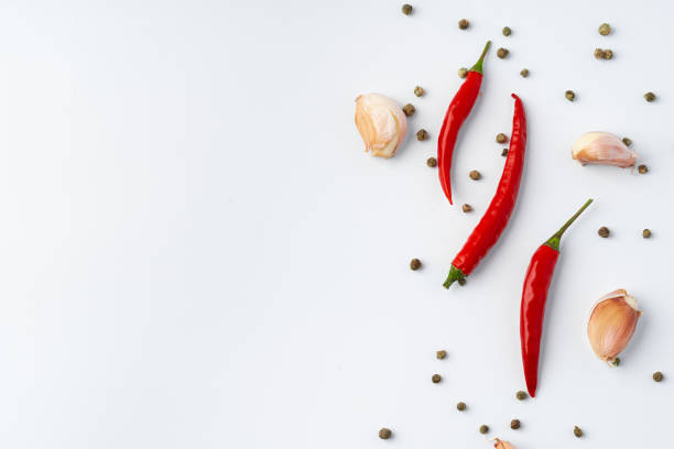 istock Red hot chili peppers isolated on white background. 1387512994