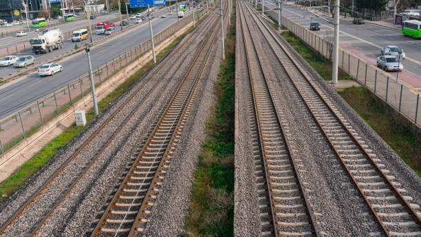 istock Rusty tracks of a two-way train track 1387513089