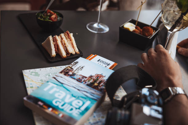 istock Man sitting in a cafe taking an aperitif 1387517649