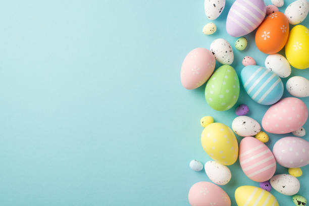 istock Top view photo of easter decorations multicolored easter eggs on isolated pastel blue background with copyspace 1387520609