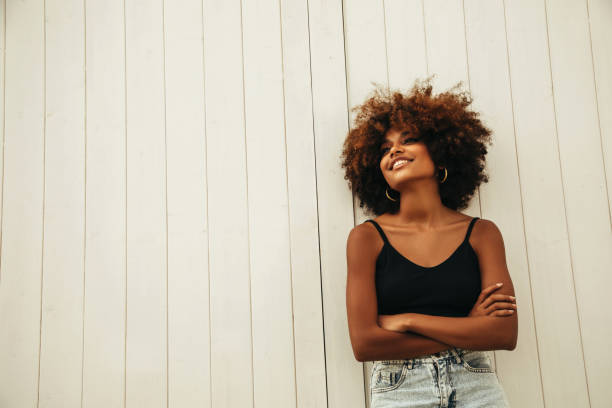 istock Pretty young afro woman 1387520819