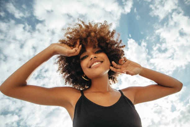 istock Pretty young afro woman 1387520846
