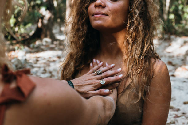 two young women healing each other, reiki concept - reiki alternative medicine chakra recovery imagens e fotografias de stock