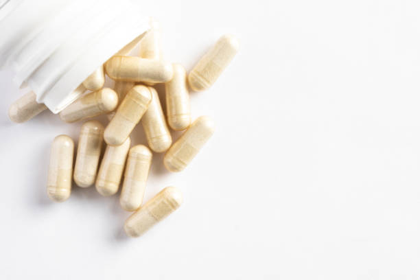 cápsulas probióticas - complemento vitamínico fotografías e imágenes de stock