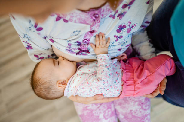 istock Mother breastfeeding her newborn baby 1387525025