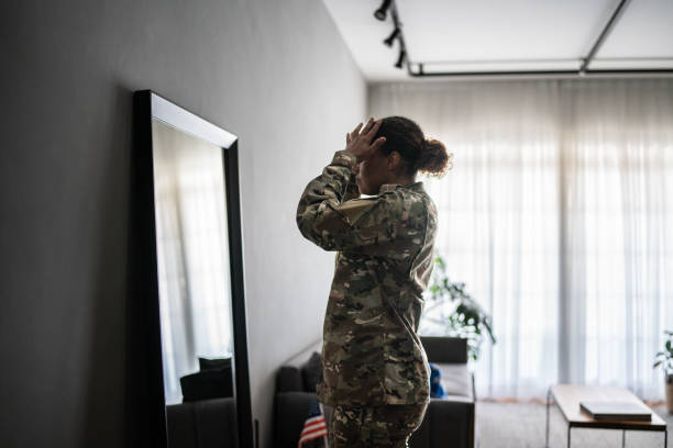 istock Female soldier getting ready ready to leave at home 1387528227