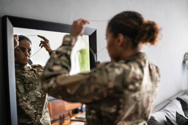Female soldier getting ready ready to leave at home