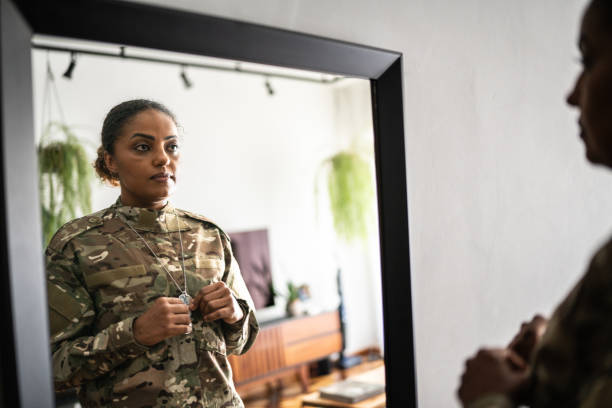 istock Female soldier getting ready ready to leave at home 1387528248