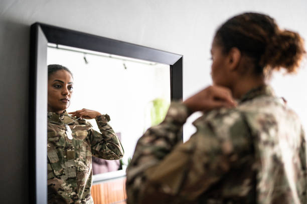 istock Female soldier getting ready ready to leave at home 1387528254