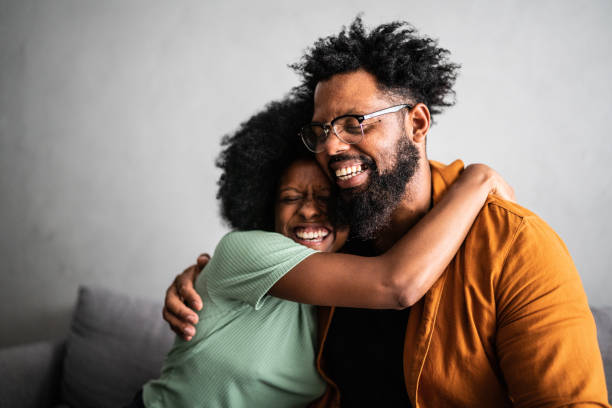 istock Happy father and daughter embracing at home 1387529071