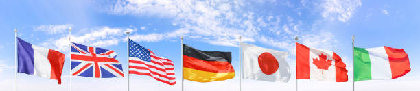 istock All G7 (Group of Seven) national flags set against blue sky 1387529165