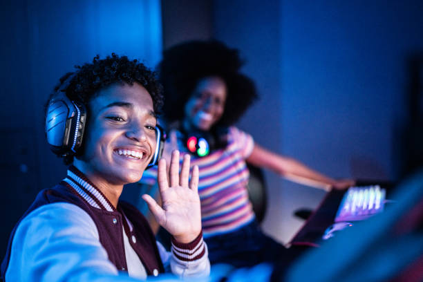 friends doing a video call or filming on the mobile phone while playing games at home - youth culture audio imagens e fotografias de stock