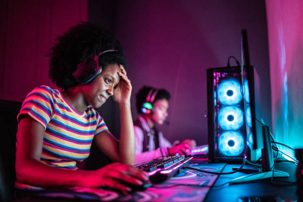 istock Worried young woman playing on the computer at home 1387529450