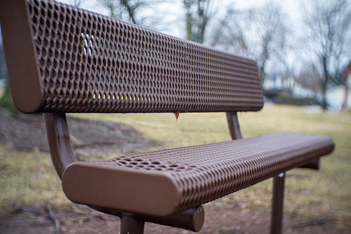 A park bench has an inviting look to it