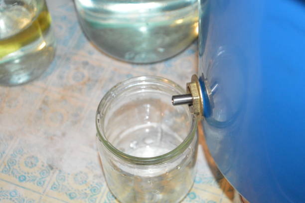 istock Moonshine still and parts for making distilled alcohol 1387533149