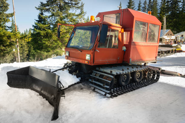 istock Snow-grooming machine. Snow cat machine making the ski run smooth. Snowcat ready to grooming for skiing and snowboarding on the mountain. 1387533488