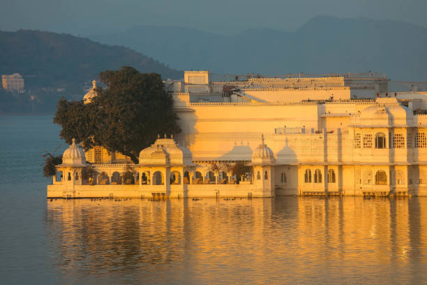 View of Udaipur on lake Pichola, India View of Udaipur and lake Pichola in early morning, Rajasthan, India egypt palace stock pictures, royalty-free photos & images