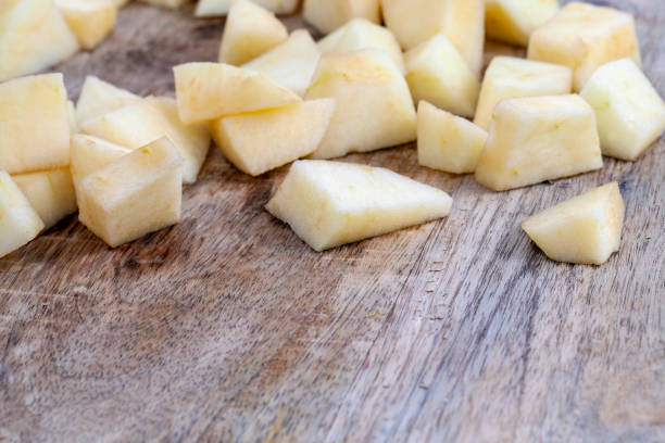 istock red ripe apple on a wooden chopping board 1387543474