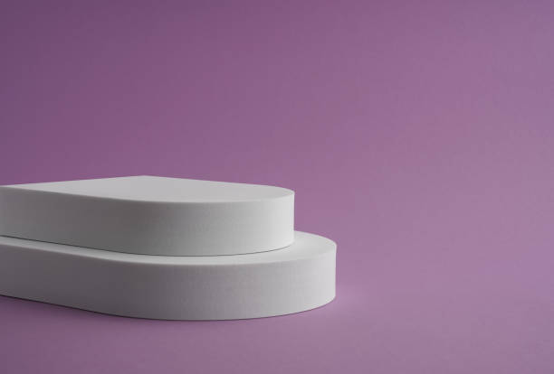 istock Two steps white podium platform on purple background with copy space 1387548560