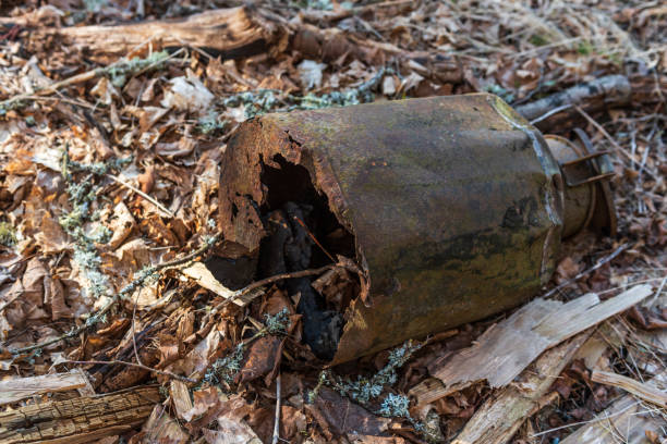 istock Old, rusty, broken, abandoned metal milk can. 1387550328