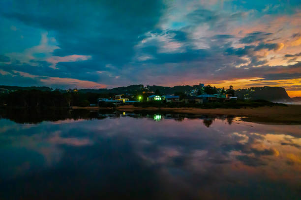 istock Dawn reflections and clouds at the seaside with lagoon 1387551290