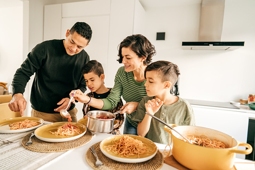 Lunchtime and Hispanic family in Ontario Kitchen